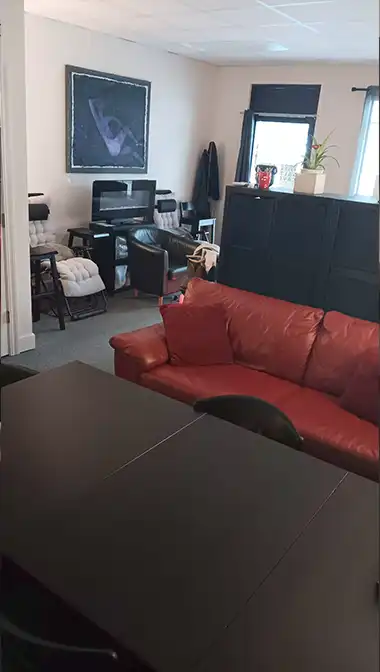 Red couch for your stuff & wellness coaching area.